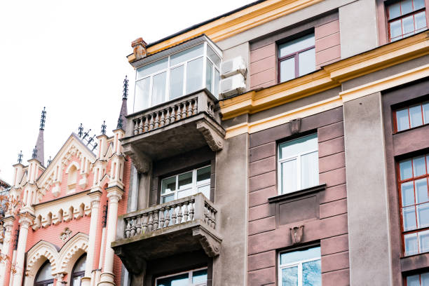 istock Vintage soviet architecture classical facade residential building with balconies. Community. District. Elegance. Front. Neighborhood. Real. History. Gray. Symmetry. Vertical 1450887566