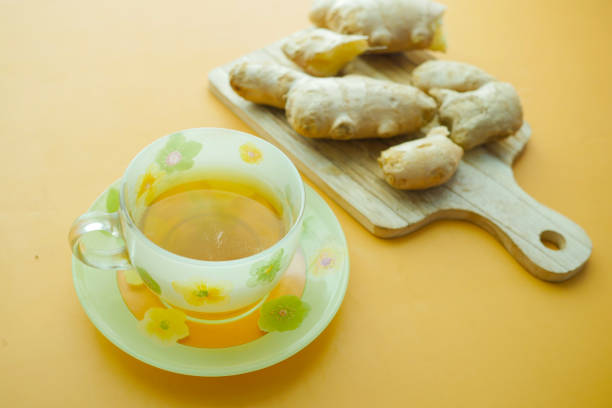 istock Ginger tea on wooden background. 1450889018