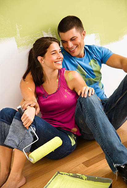 Couple painting home. stock photo