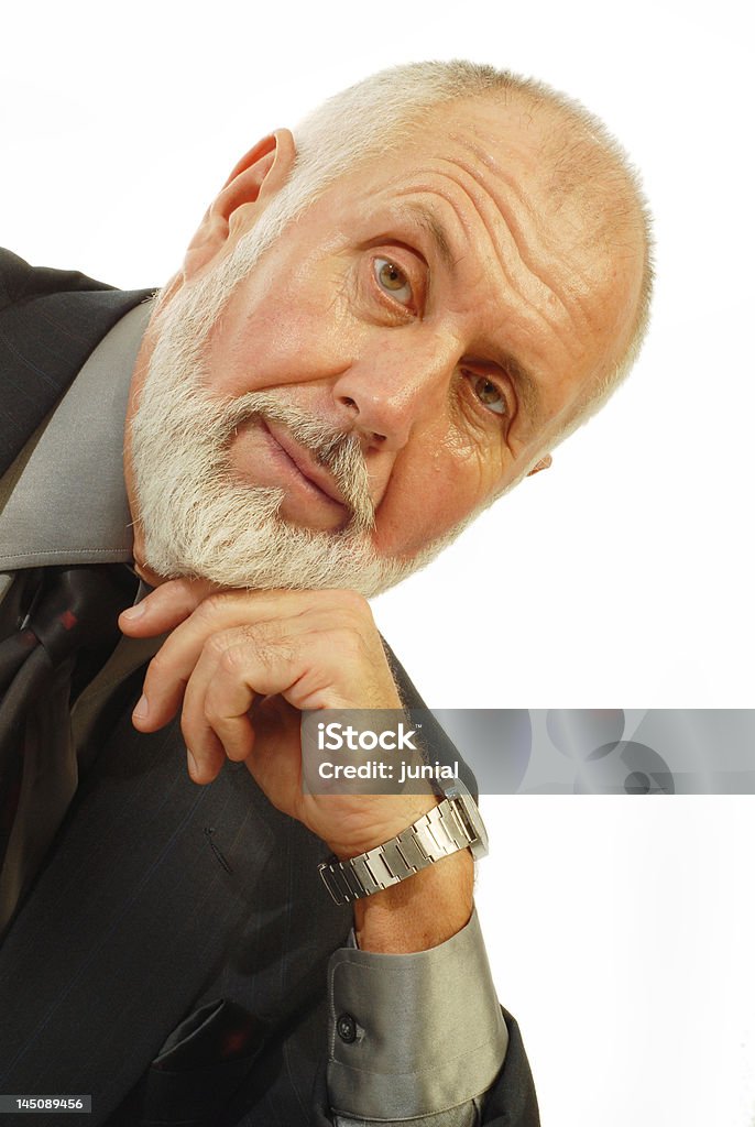 Handsome older businessman Portrait of a handsome older businessman in an elegant suit; isolated on white Active Seniors Stock Photo