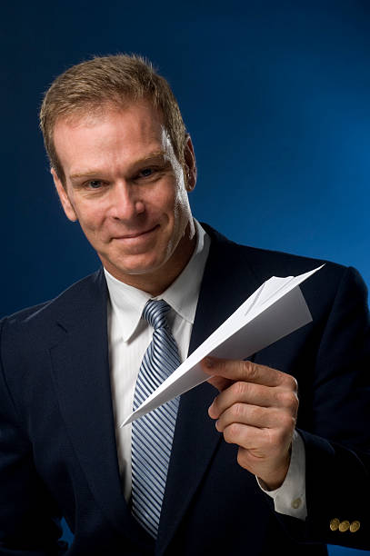 istock business man with paper airplane 145089576