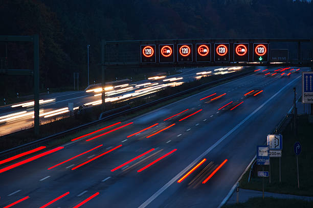 istock night traffic on german autobahn with illuminated speed limit signs 145090134