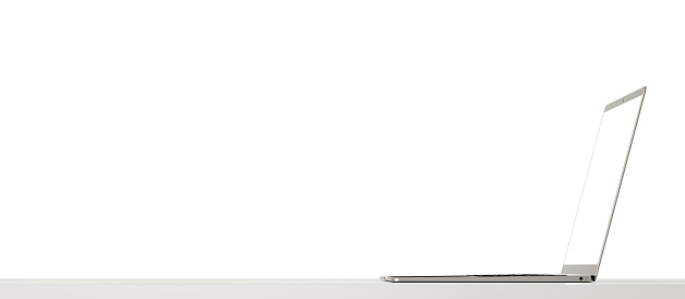 Mockup laptop. Slim modern laptop with white blank screen on grey background. side view. wide web banner. copy space. 3d rendering