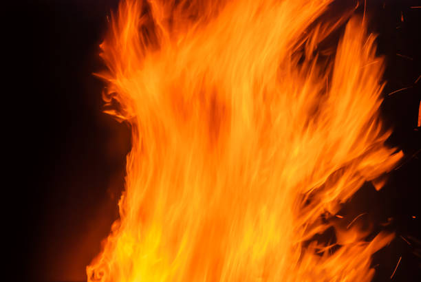 istock Abstract blaze fire flame texture for banner background. Fire sparks particles with flames isolated on black background. Beautiful flames. Fuel, power and energy 1450916891