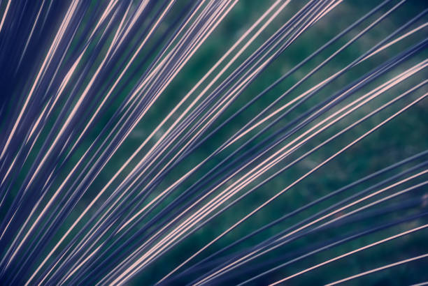 Abstract glass background close up. Texture of wavy glass illuminated with multi-colored light. Abstract background to use in graphic presentations and banners.