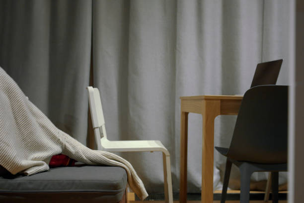 istock shut curtains and simple furniture 1450918523