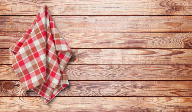 istock Hanging kitchen towels, napkin on wooden desk. 1450932182