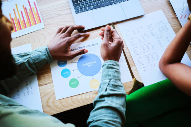 istock Businesspeople discussing a marketing project while sitting at an office table 1450933595