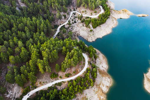Drone view of mountain lake with road