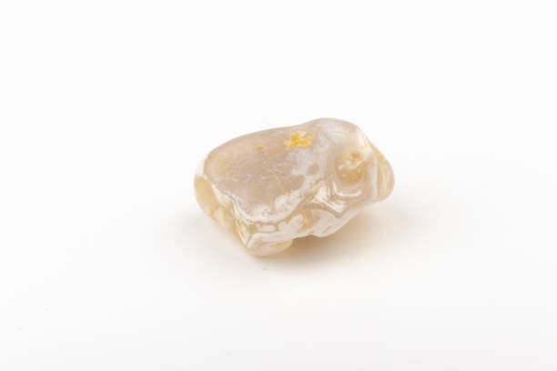 istock Multicolored gemstone, tumbled mineral. Bostwan agate of various sizes on a white background. 1450940168