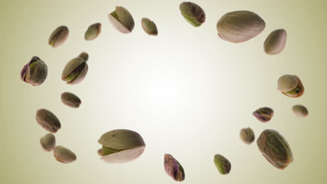Flying pistachios explosion slow motion, green pistachio video with transparent background