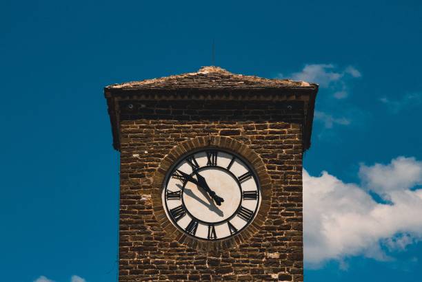 istock Outdoor view of a clocktower against blue sky 1450945137