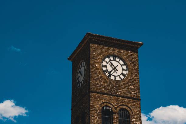 istock Outdoor view of a clocktower against blue sky 1450945140