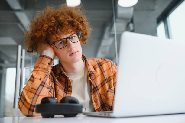 istock Stylish male freelancer working on new startup project making internet researchers analyzing data using laptop 1450951329