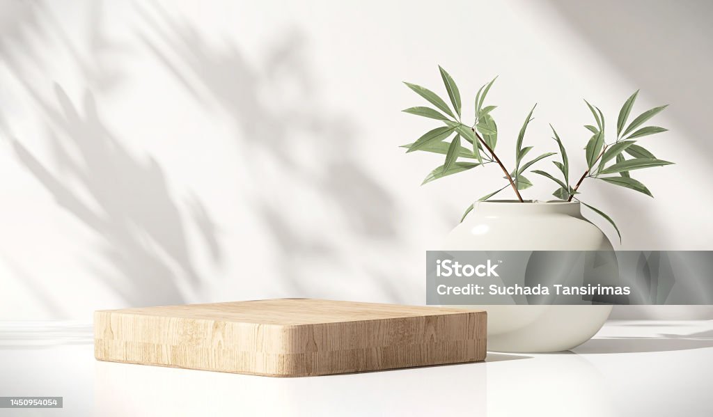 Modern, minimal square wooden podium with white ceramic potted plant on white counter table in dappled sunlight and shadow on white wall - Royalty-free Achtergrond - Thema Stockfoto Modern, minimal square wooden podium with white ceramic potted plant on white counter table in dappled sunlight and shadow on white wall - Royalty-free Achtergrond - Thema Stockfoto