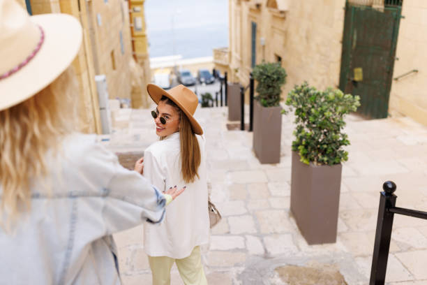 istock Female travelers exploring city on their vacation 1450955811