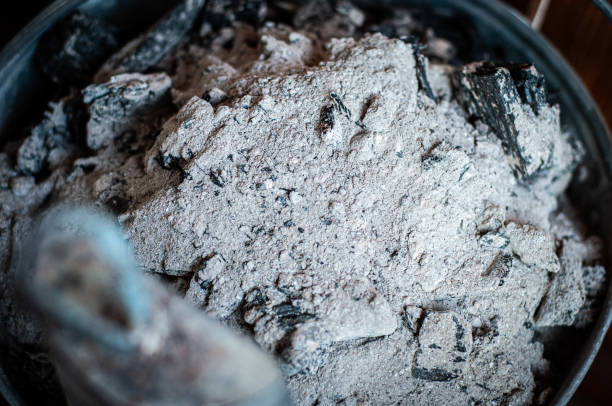 istock Charcoal and ash are cleaned from the home fireplace in an iron galvanized bucket. 1450956800