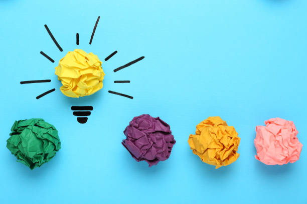 istock Creative flat lay composition with colorful paper balls on light blue background. Idea concept 1450964162