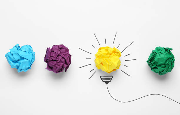 istock Creative flat lay composition with colorful paper balls on white background. Idea concept 1450964181