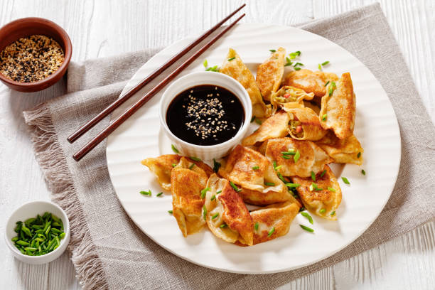 istock gyoza, wonton wrappers stuffed with pork, cabbage 1450964333