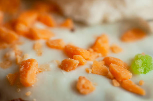 Orange pastry topping for decoration of confectionery, close-up, macro shot.