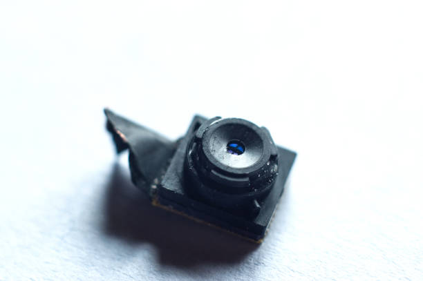 istock Replacing the camera module in the phone. Macro shot of a camera on a white background. 1450964979