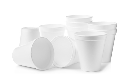 Many clean styrofoam cups on white background