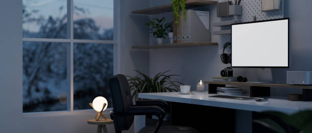 istock Modern home working room in the evening with modern computer desk with computer mockup 1450967030