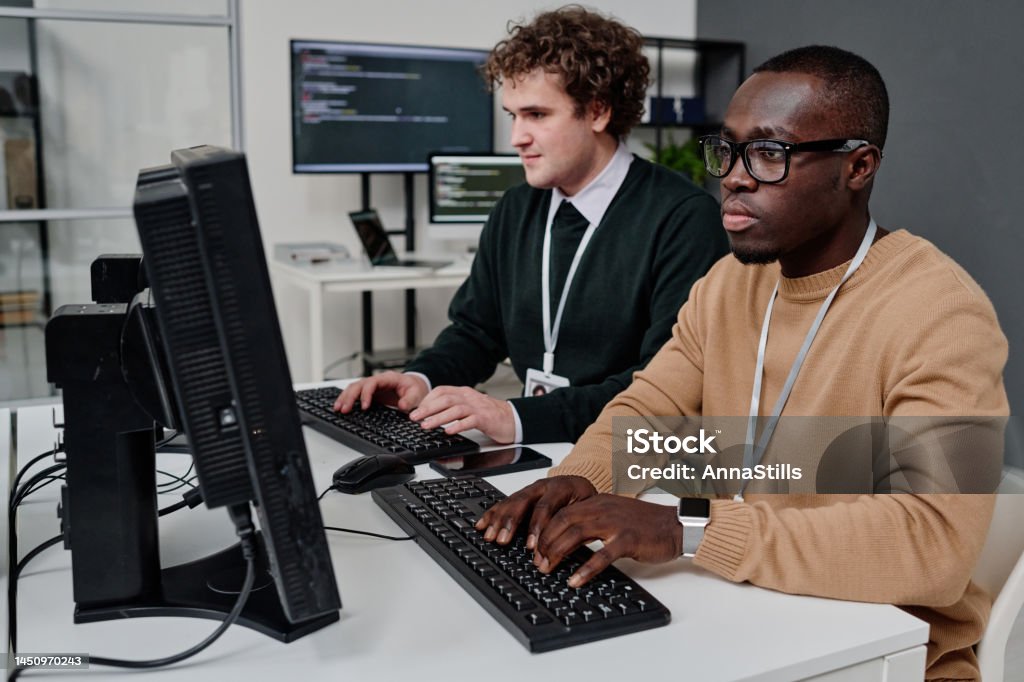 Two Programer Two Programmers Writing Security Code On Computers Stock Photo ...