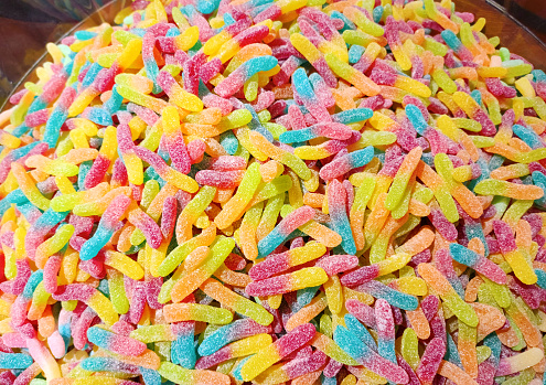 Colorful and bright jelly worms in a bowl