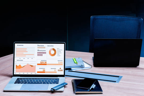 istock Slide show presentation on display laptop with notebook on table in meeting room 1450974580