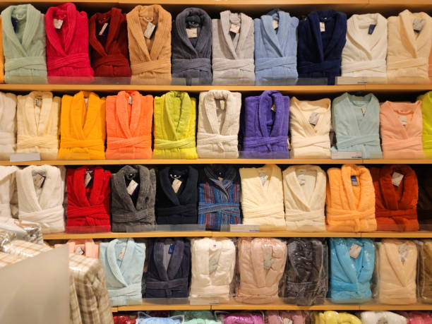 istock Shelves with different kinds of colorful folded bathrobs 1450977253