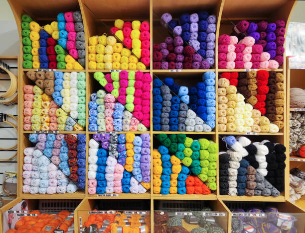 istock Store shelves packed with colorful yarn for knitting 1450977910