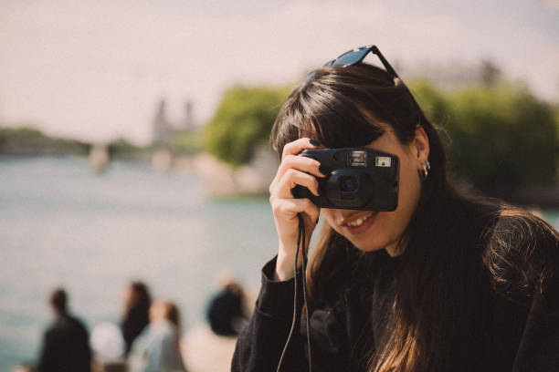 istock Woman with analog camera film 1450979700