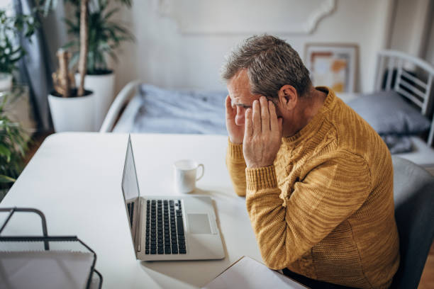 istock Headache, tired business man in the office 1450980367