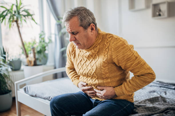 istock An elderly man has a stomach ache 1450982348
