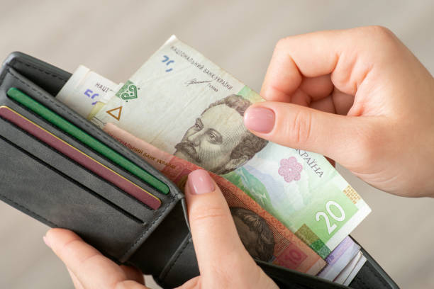istock Small money in the wallet, paying for goods concept 1450983363