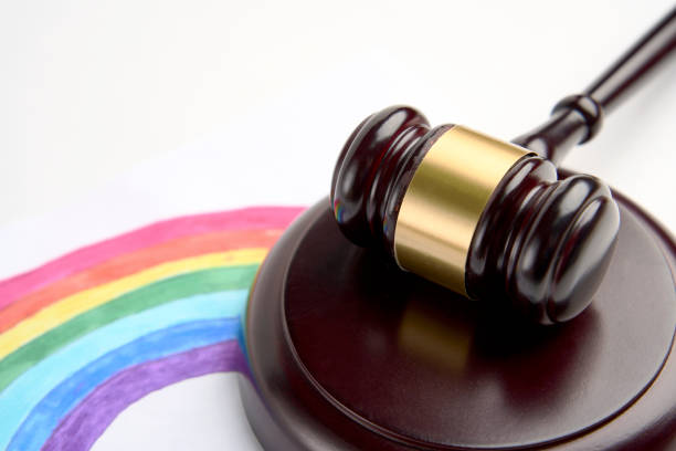 istock Judge gavel and LGBT rainbow on a white background 1450983913