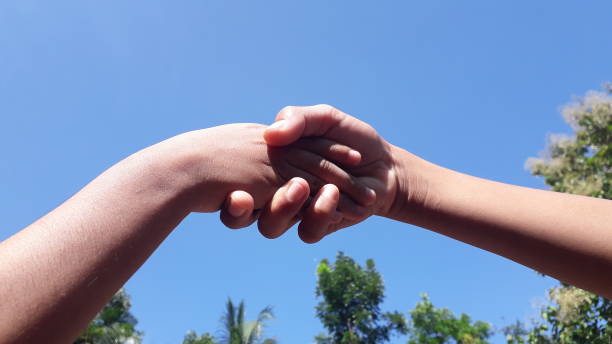 istock Indonesian hand's childrens under the blue sky 1450992649