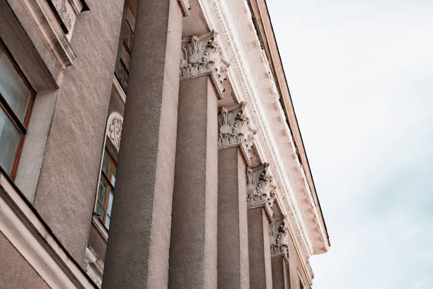 istock Rectangular stone columns with stucco on the facade of old historical building. Design. Pillar. Architecture. History. Heritage. Historical. Urban. Post. Right-angled porch column. Age-old 1450994815