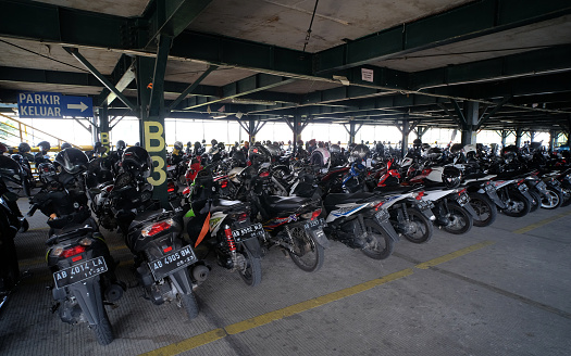 Yogyakarta, Indonesia, Oct 29, 2019. Motorcycles fill the multi-storey public parking lot located in the city center.