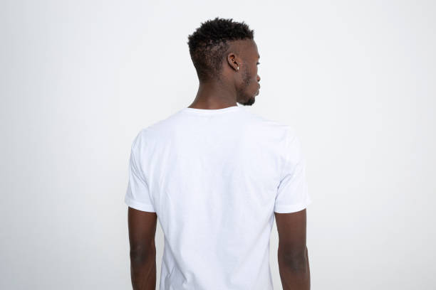 african-american man in white t-shirt against white background. - rear view imagens e fotografias de stock