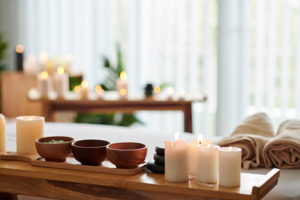 istock Burning Candles and Herbs on Table 1450998985