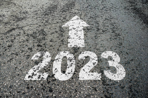 istock number 2023 and arrow pointing ahear on cracked asphalt 1450999553