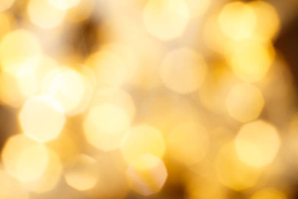 istock christmas beautifull shiny gold background. sparkle festive blurred bokeh 1451000097