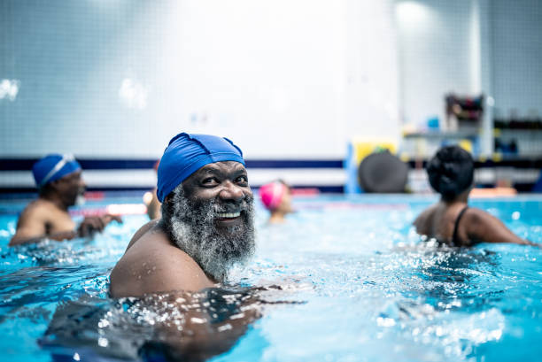 istock Senior man at swimming pool 1451002371