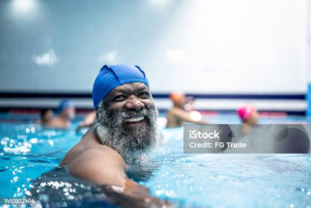 Portrait Of A Senior Man At Swimming Pool Stock Photo - Download Image Now - Healthy Lifestyle, Senior Adult, Swimming