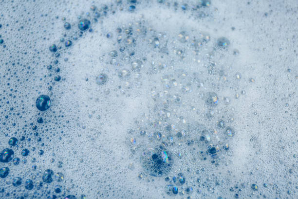 istock Detergent foam as background, top view. Hand washing laundry 1451005054