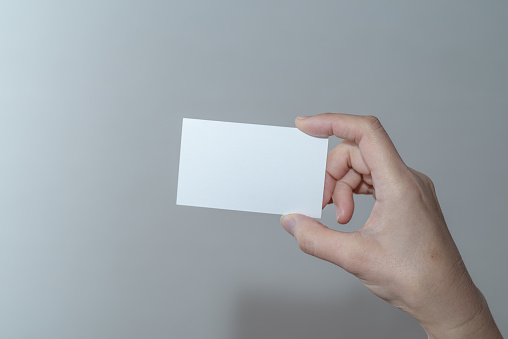holding a white card