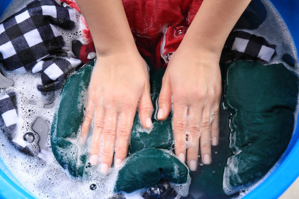 istock Woman washing garment in basin, closeup. Laundry 1451005422